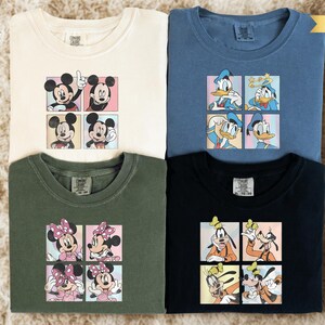 four t-shirts with cartoon character designs, including Mickey Mouse, Minnie Mouse, Goofy, and Donald Duck.
