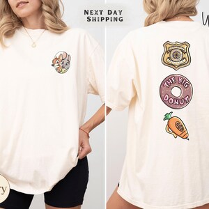 The image is a collage of two photos of a woman wearing a white t-shirt with various cartoon-style designs and text on the back.