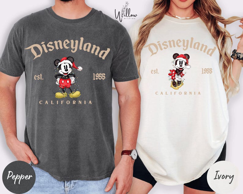 two t-shirts with Disneyland branding, one gray and one white, both with Mickey Mouse as the central character.