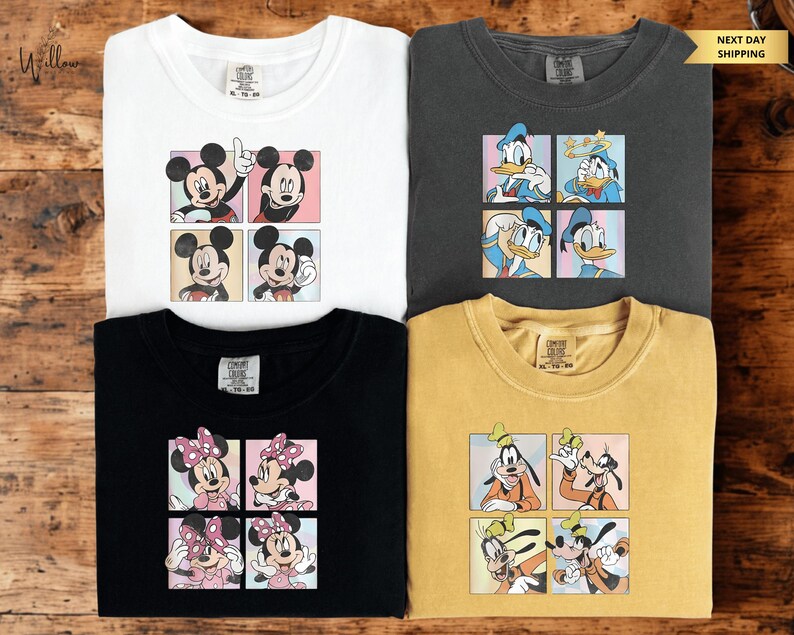 four t-shirts featuring cartoon characters from Disney's Mickey Mouse and Goofy.