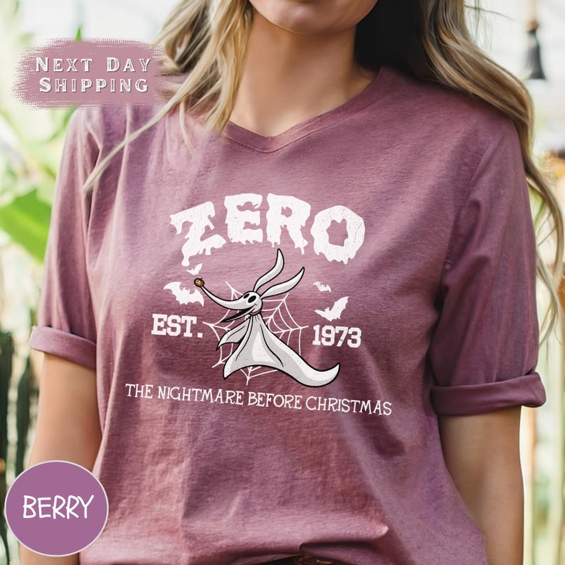 a woman wearing a purple zero t - shirt with a bat on it