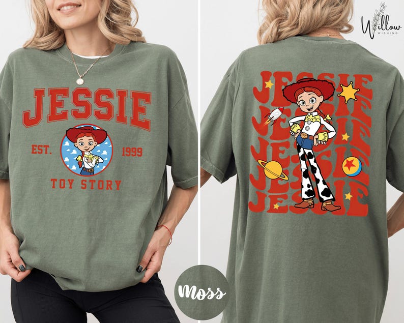 A woman wearing a green t-shirt with a graphic of a character from the Toy Story franchise, specifically named Jessie.