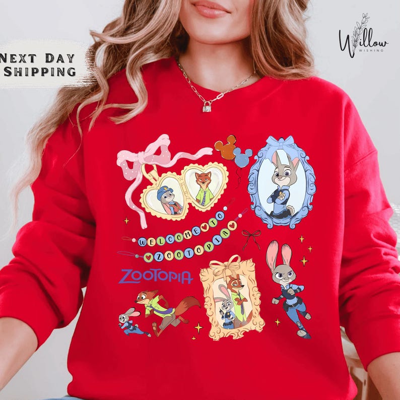 A woman wearing a red sweater with various cartoon animal characters and designs printed on it.