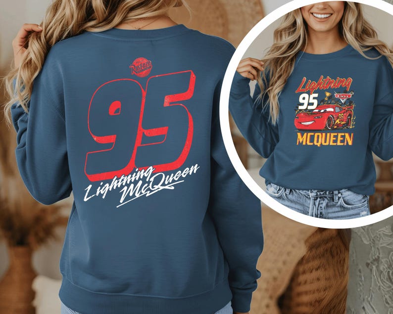 A woman wearing a blue sweatshirt with the number 95 and the text "Lightning McQueen" printed on it.
