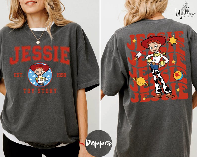 a woman wearing a gray t-shirt with a design of a character from the Toy Story franchise.
