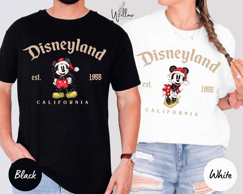 a man and a woman wearing Disneyland-themed t-shirts.