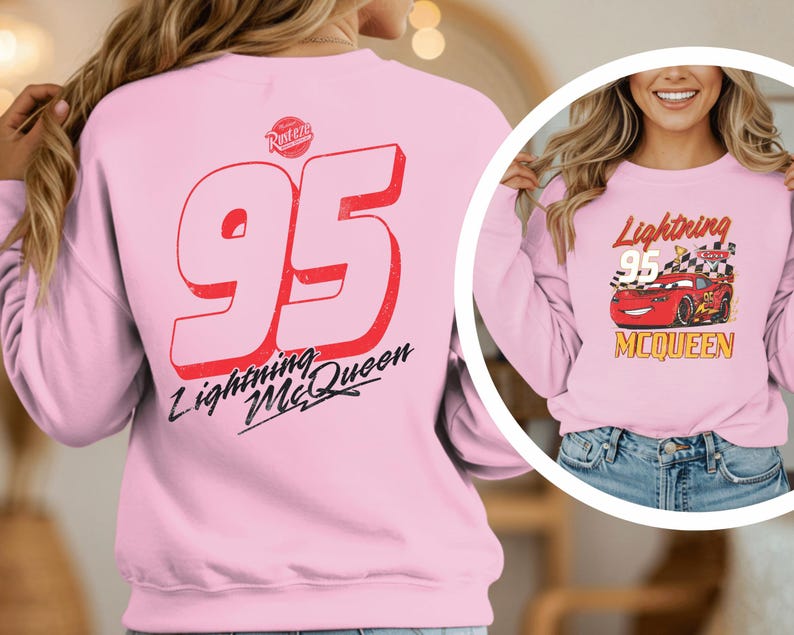 A woman wearing a pink sweatshirt with the number 95 and the text "Lightning McQueen" printed on it.