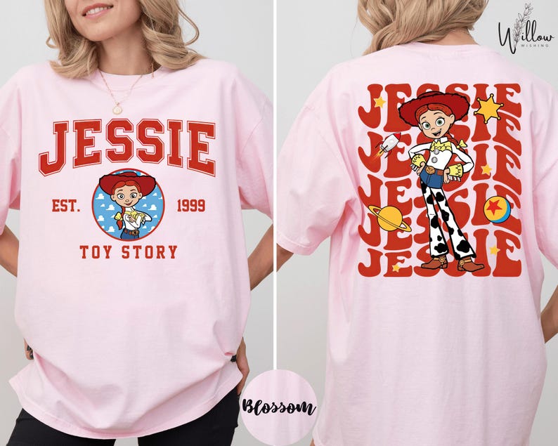 A woman wearing a pink t-shirt with a cartoon character from the Toy Story franchise.