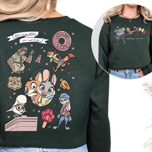 a green sweatshirt with a collage of cartoon animal characters and various other elements, including a police officer, a police dog, and a police station.