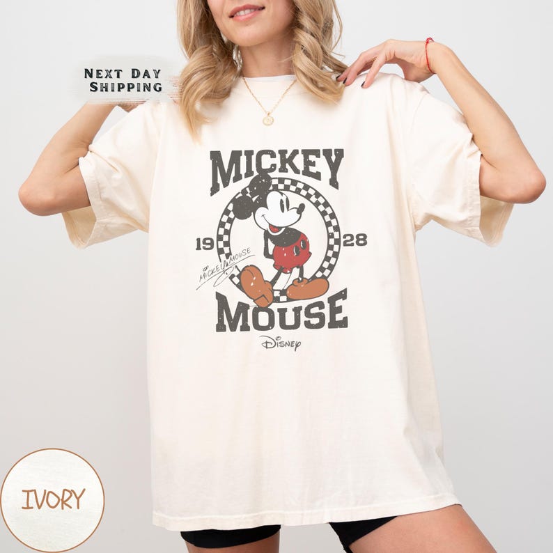 a woman wearing a mickey mouse t - shirt