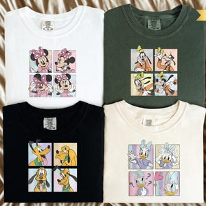 four t-shirts with different cartoon character designs, including Mickey Mouse, Minnie Mouse, Goofy, and Donald Duck.