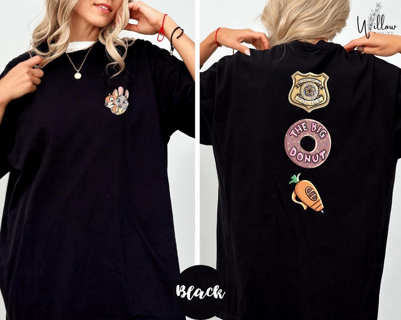 A woman wearing a black t-shirt with various cartoon and police-themed designs on the back.