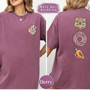 The image is a collage of two photos of a person wearing a purple t-shirt with various cartoon-style designs and text.