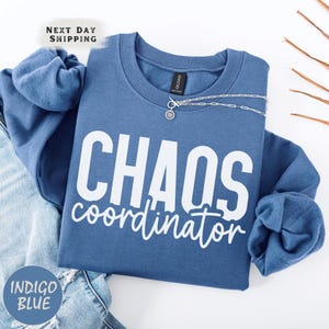 a blue shirt that says chaos coordination on it