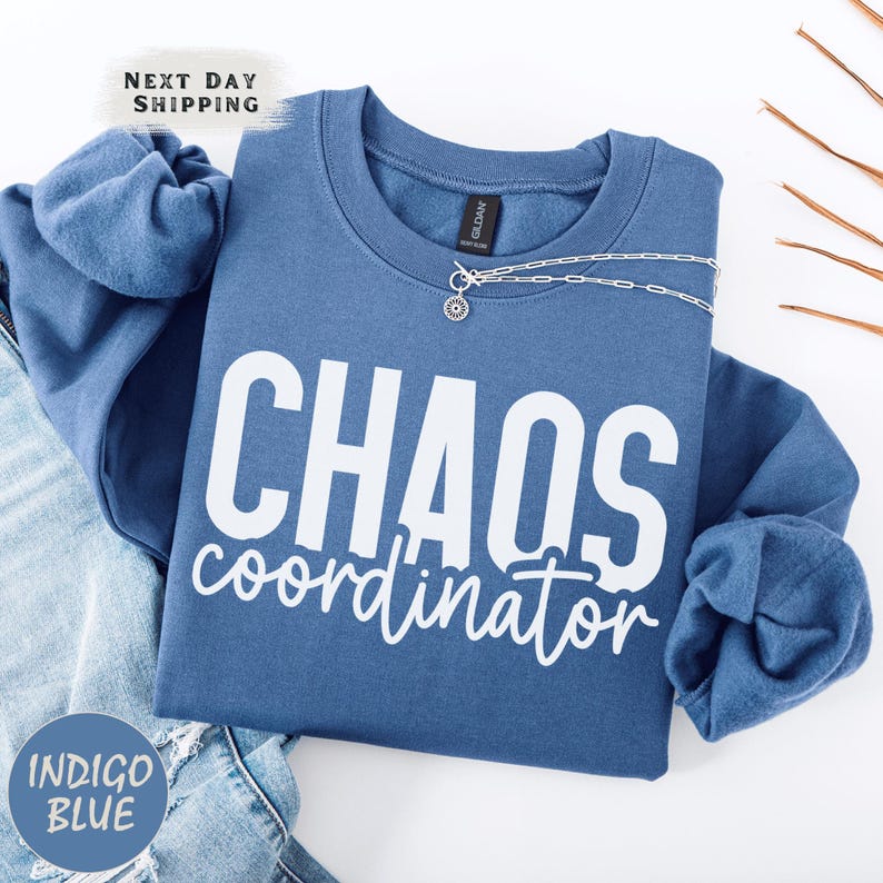 a blue shirt that says chaos coordination on it