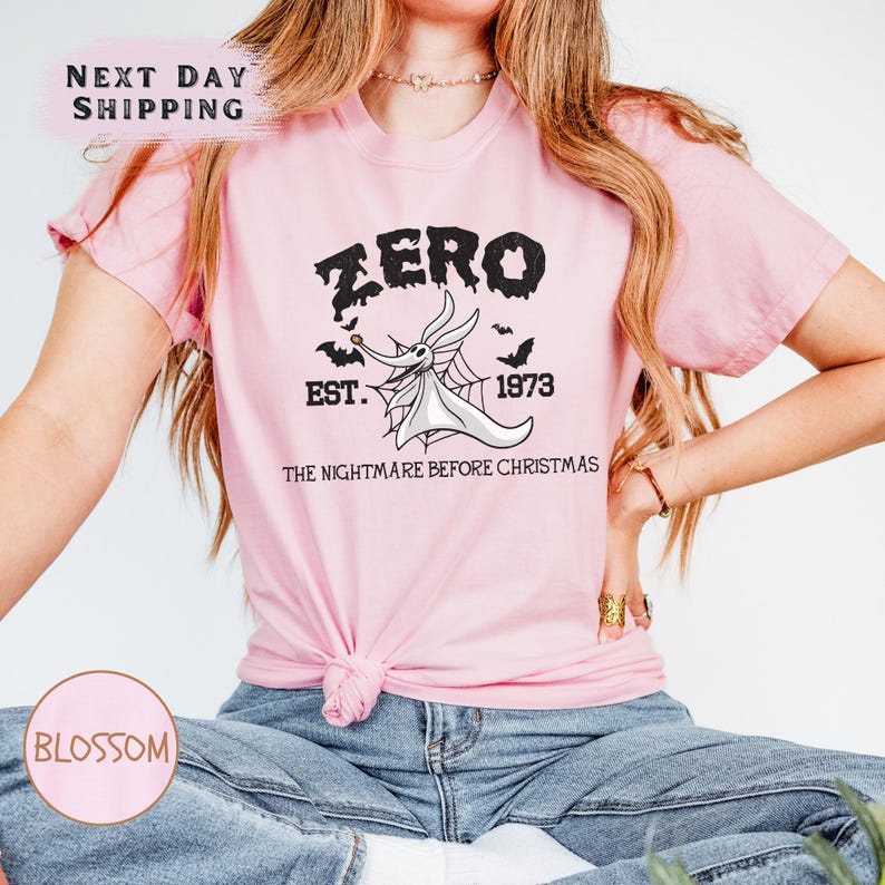 a woman wearing a pink shirt that says zero best before christmas