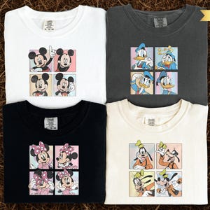 four t-shirts with cartoon character designs, including Mickey Mouse, Minnie Mouse, Goofy, and Donald Duck.