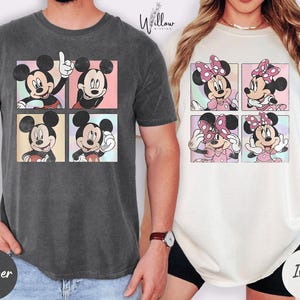 A man wearing a gray t-shirt with a graphic of Mickey Mouse and a woman wearing a white t-shirt with a graphic of Minnie Mouse.