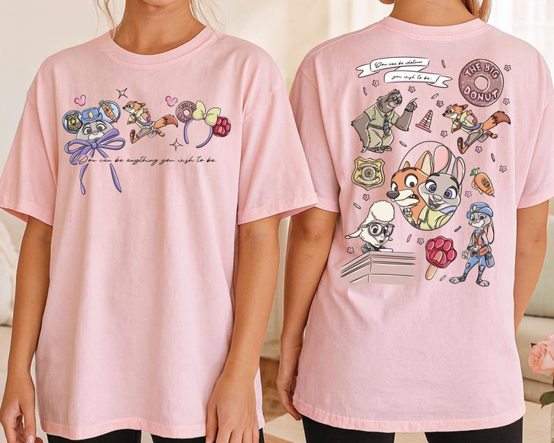 two pink t-shirts with cartoon characters and text printed on them.