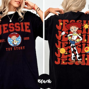 a woman wearing a black t-shirt with a design of a character from the Toy Story franchise.