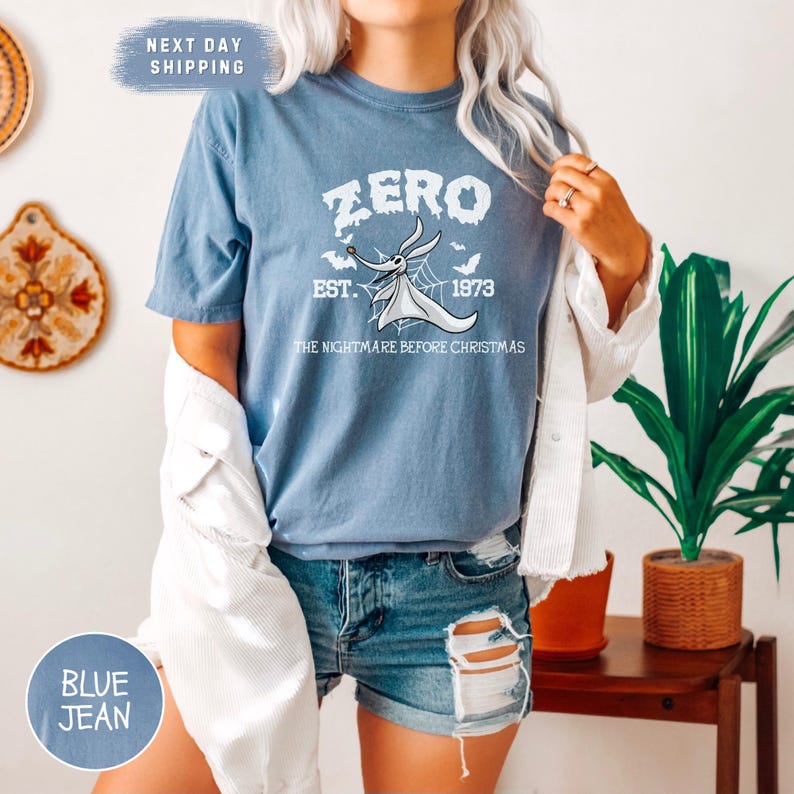 a woman with white hair wearing a zero t - shirt