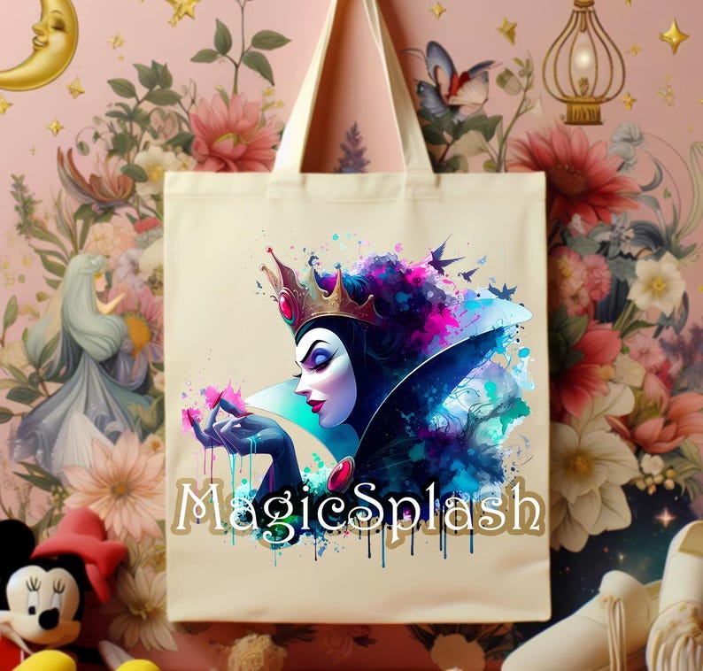 May include: Cream-colored tote bag featuring a watercolor illustration of a queen with a crown, holding pink flowers. The design includes vibrant blues, purples, and pinks, with the text "MagicSplash" in a gold font. The bag has a simple, sturdy design.