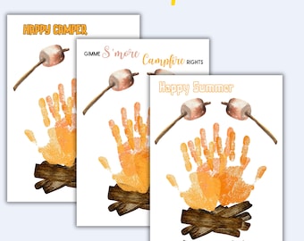 May include: Three white cards with handprint art, marshmallows, and text. The cards say "Happy Camper", "Gimme S'more Campfire Rights", and "Happy Summer". The handprints are orange and the marshmallows are brown and white.