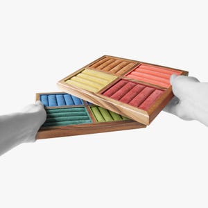 May include: Two stacked wooden jewelry display trays featuring multiple velvet-lined compartments. The top tray contains sections in orange, yellow, and pink, while the bottom tray features blue, green, and light green velvet ring inserts.