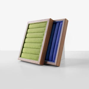 May include: Two wooden ring boxes with velvet lining. One box is green and the other is blue.