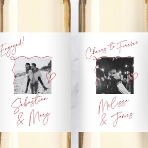 May include: Two white wine bottle labels featuring custom black and white photographs framed by red line art. The left label reads Engaged! Sebastian & Mary. The right label reads Cheers to Forever, Melissa & James, with red script text and heart icons.