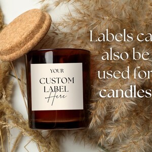 May include: A dark amber glass candle jar with a cork lid and a square white label featuring the black text YOUR CUSTOM LABEL Here. The text Labels can also be used for candles is printed in white on the right side of the image.
