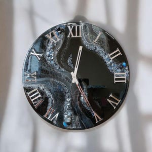 Black and silver handmade resin wall clock with Roman numerals