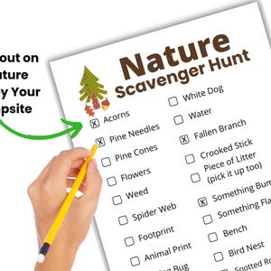 A Nature Scavenger Hunt with a hand holding a pencil and checking off items on the scavenger hunt checklist for hiking.