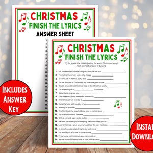 A table top with the Christmas song game and Answer sheet that is included in the Christmas Finish the Lyrics game. It's an instant download game.