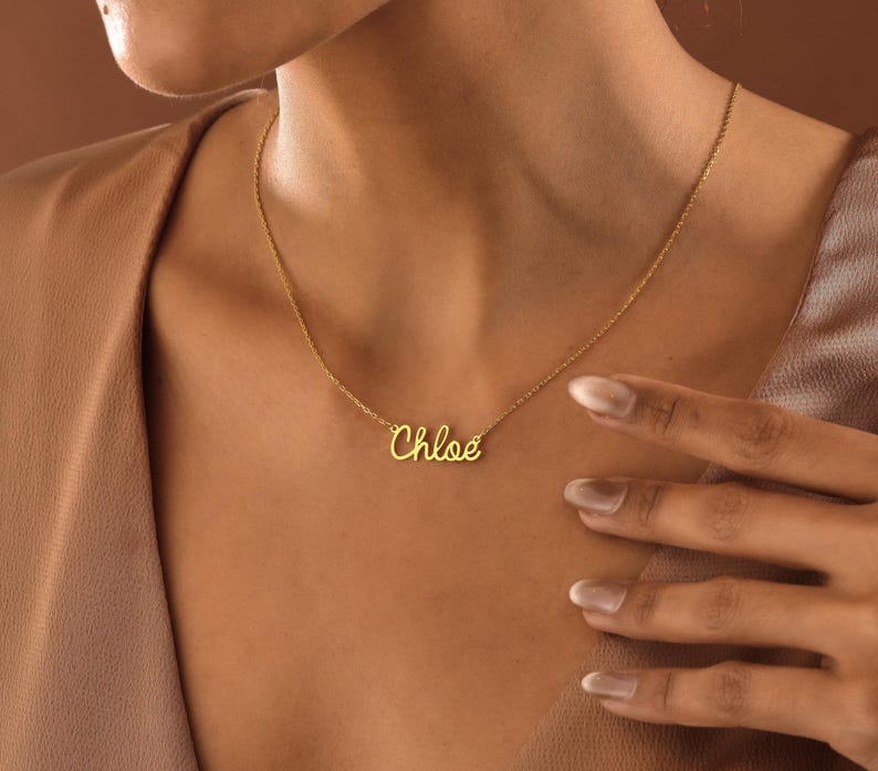 Celebrate loved ones with a 14K Gold Name Necklace. A one-of-a-kind gift for her, for mom, or anyone close to your heart. Perfect for birthdays, holidays, or simply because.