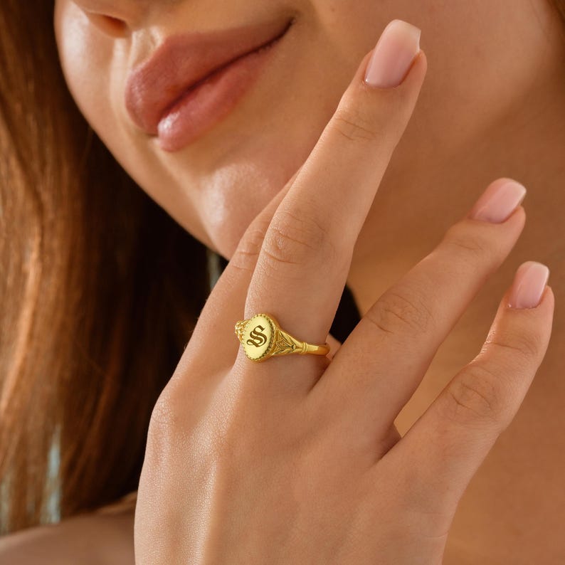 Express your style with the 14K Gold Custom Initial Signet Ring. This vintage Gothic ring is personalized with an Old English letter, making it a perfect gift or statement piece. Order yours today!