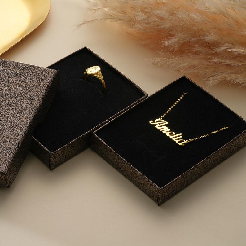 Present your 14K Gold Custom Initial Signet Ring in a luxurious gift box. Each ring is elegantly packaged, making it the perfect gift for any occasion. Add a touch of sophistication to your special gift with Goldmira's beautiful packaging. Shop now!