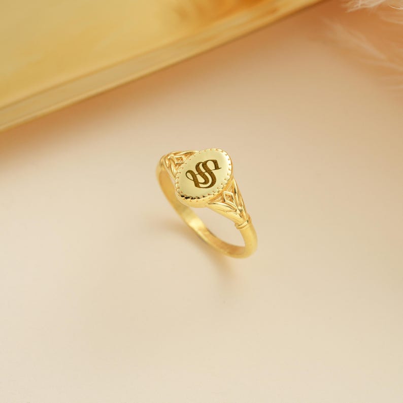 Celebrate individuality with the 14K Gold Custom Initial Signet Ring. This personalized Gothic ring features an Old English initial, making it the perfect statement piece or unique gift. Shop Goldmira now!