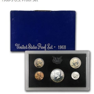 May include: A 1968 U.S. Proof Set in a blue box. The set includes five coins displayed in a black case. The box is labeled "United States Proof Set • 1968". The coins feature portraits and an eagle emblem.
