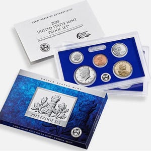 May include: A 2025 United States Mint Proof Set featuring American Women Quarters. The set includes multiple coins in protective cases, a certificate of authenticity, and a blue and silver box with the text "2025 Proof Set".
