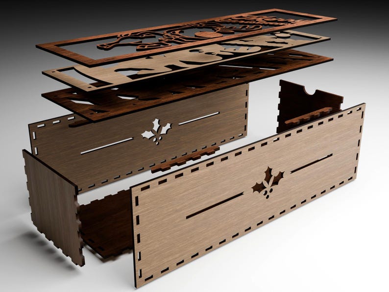 May include: Assembled wooden box with a Christmas theme. The box is made of several layers of laser-cut wood, with a holly leaf design and decorative cutouts. The box is unassembled, showing the individual pieces.