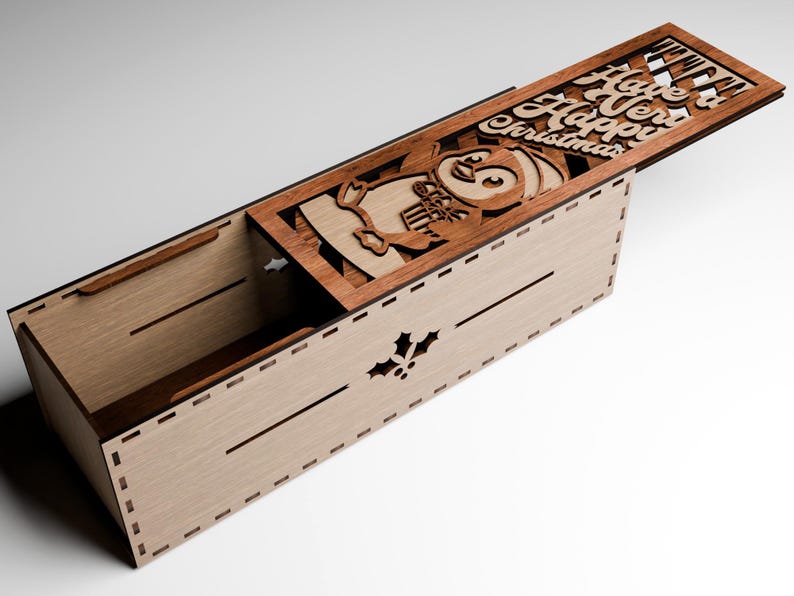 May include: Wooden box with a hinged lid, featuring a laser-cut design of a penguin holding gifts, and the words "Have a Very Happy Christmas." The box is light brown with darker brown accents.