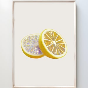 May include: Two lemon slices, one with a purple and gold glitter design and the other with a gold glitter design, against a white background.