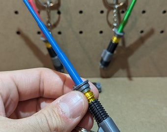 Porte-clés sabre laser rétractable inspirés de Star Wars (produits phosphorescents disponibles !)