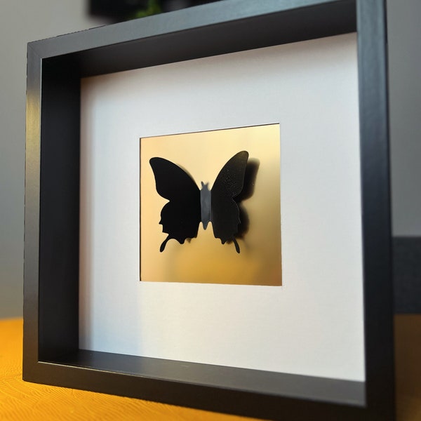 foto vlinder quadro con farfalle zwart en goud