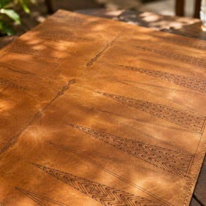 Minimalist leather backgammon board ideal for home décor and game nights.