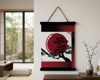 May include: A wall hanging with a Japanese-inspired design. The artwork features a large red sun, a silhouetted tree, and mountain shapes against a white background. The top and bottom are black.