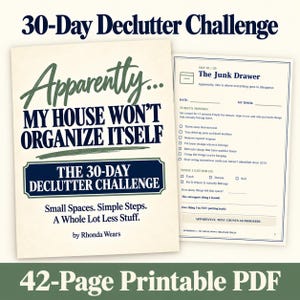 May include: A 42-page printable PDF titled 30-Day Declutter Challenge, Apparently... My House Won't Organise Itself by Rhonda Wears. The cover features dark blue and green text on a cream background, with an interior page showing a Day 01 task list.