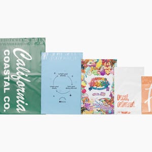 May include: An assortment of colorful poly mailer shipping bags. The bags vary in size and feature text and graphics, including "California Coastal Co.", a recycling diagram, and the words "Decaf, delivered."
