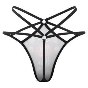 Puede incluir: Lencer&iacute;a negra con un dise&ntilde;o &uacute;nico. La prenda presenta una tela blanca transparente con un patr&oacute;n de caras y un gr&aacute;fico de labios rojos. Las correas negras crean un patr&oacute;n en forma de estrella.